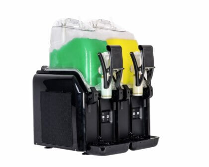 Dual slushie machine with green and yellow frozen drinks in black dispenser unit.